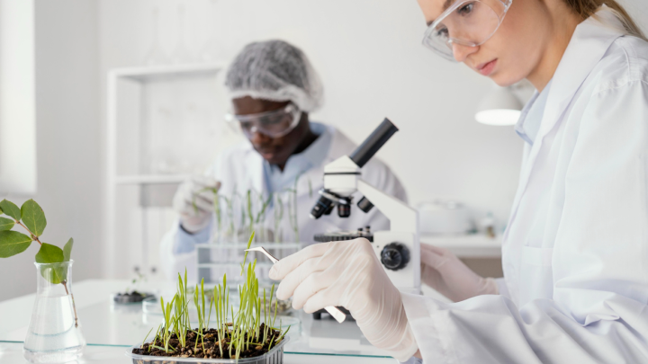 Technician conducting environmental testing of air, water, and soil in laboratory using advanced equipment